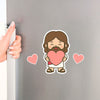 Cute Chibi Jesus decorative refrigerator magnets with heart magnets displayed on a kitchen fridge. Handmade Christian magnet set made in Los Angeles.